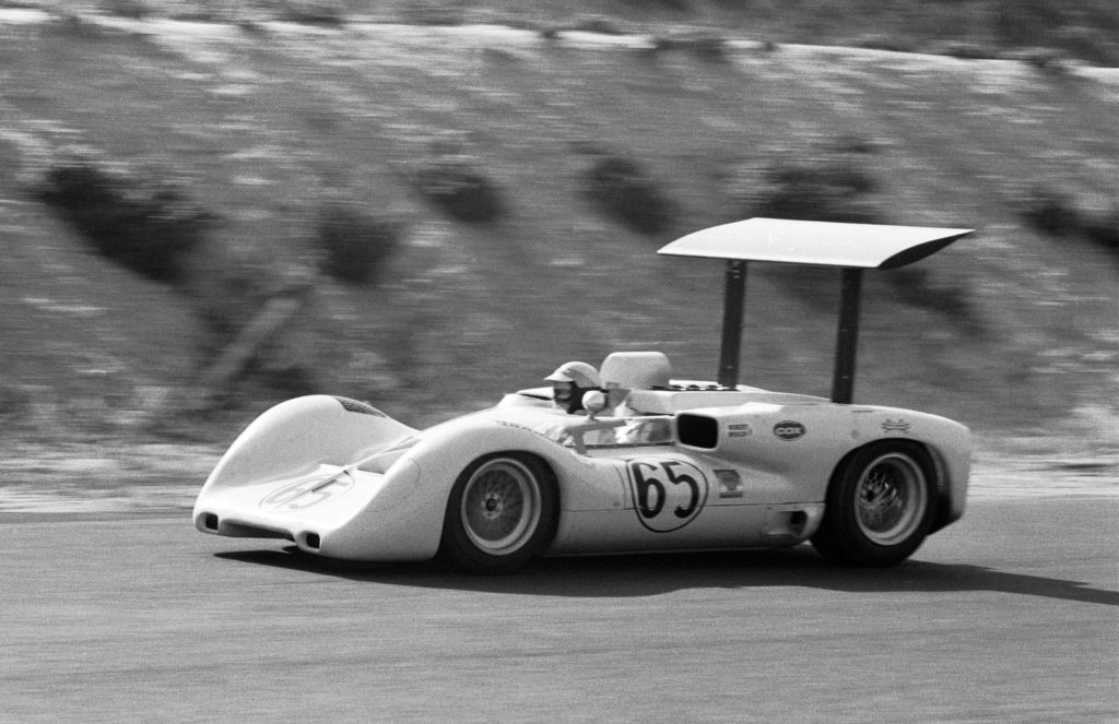 Distinguished by its huge, downforce-generating and driver-adjustable wing, and side-mounted radiators, the 1966 introduction of the Chaparral 2E helped alter the course of race car design.